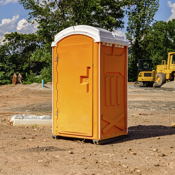 what is the cost difference between standard and deluxe portable restroom rentals in Mallory